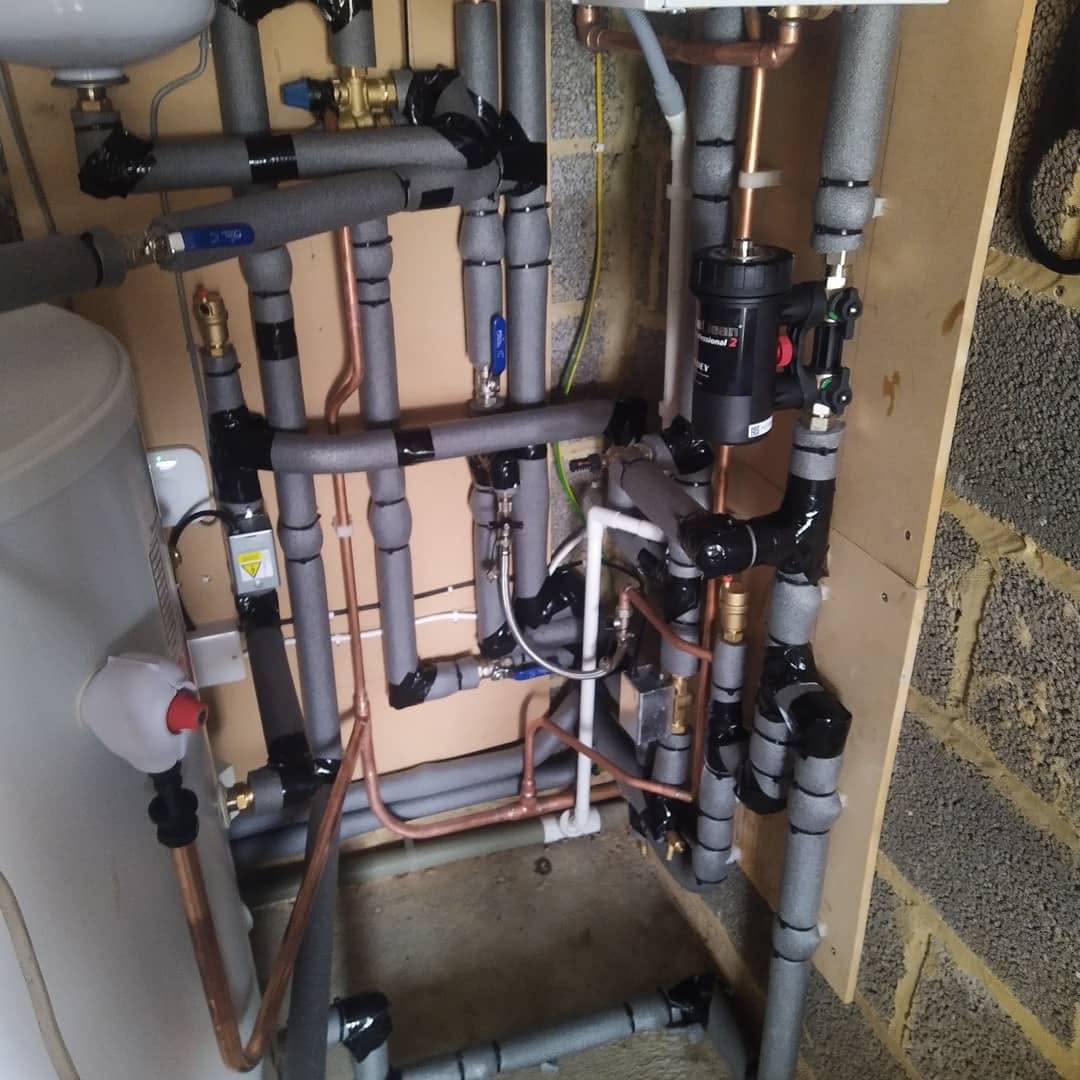 Copper manifold and Magnaclean filter fitted during a heating-system rebuild